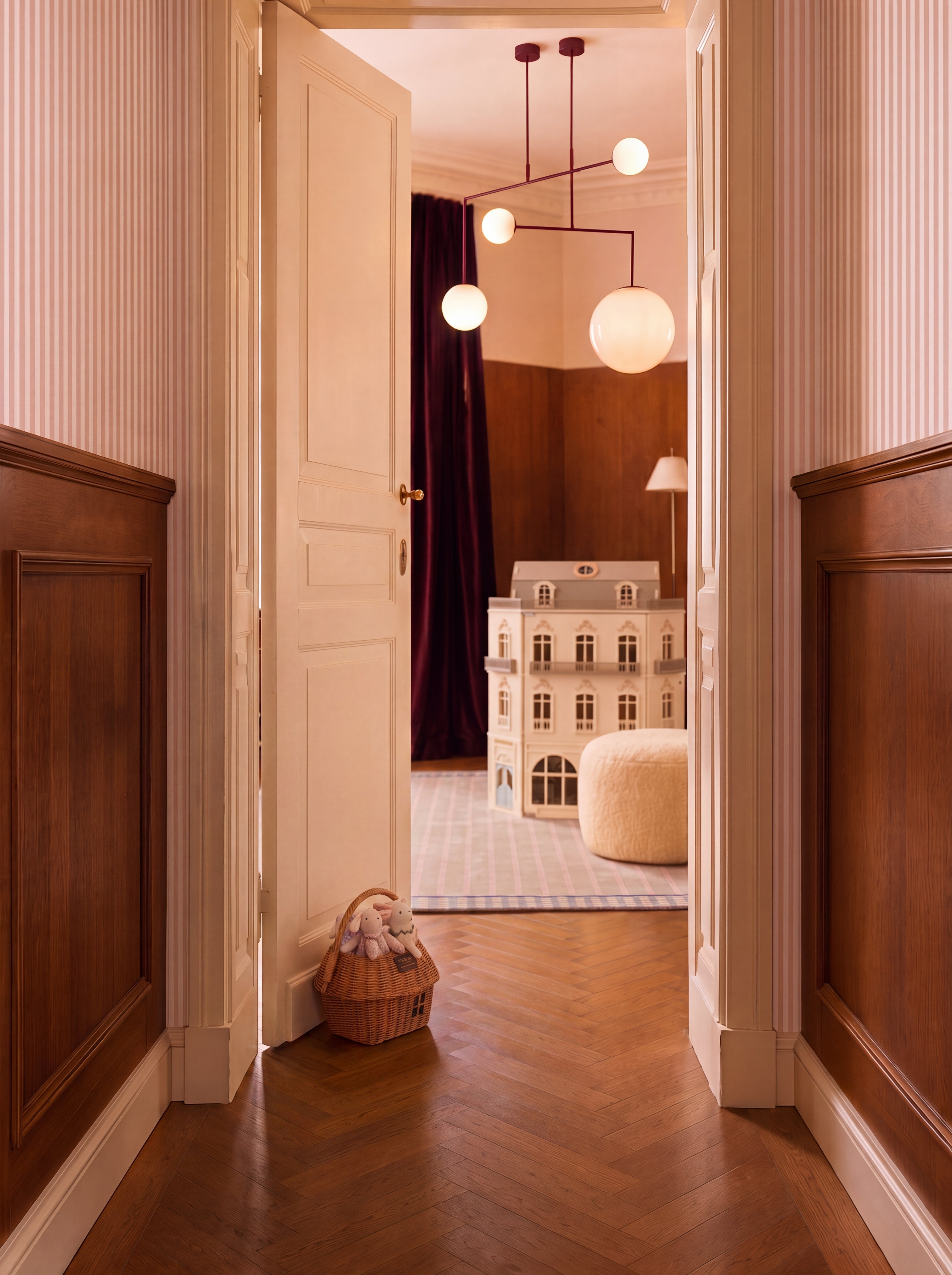 Luxury room design featuring an elegant decorative dollhouse, stylish toys, warm wood paneling, herringbone flooring, and modern lighting.