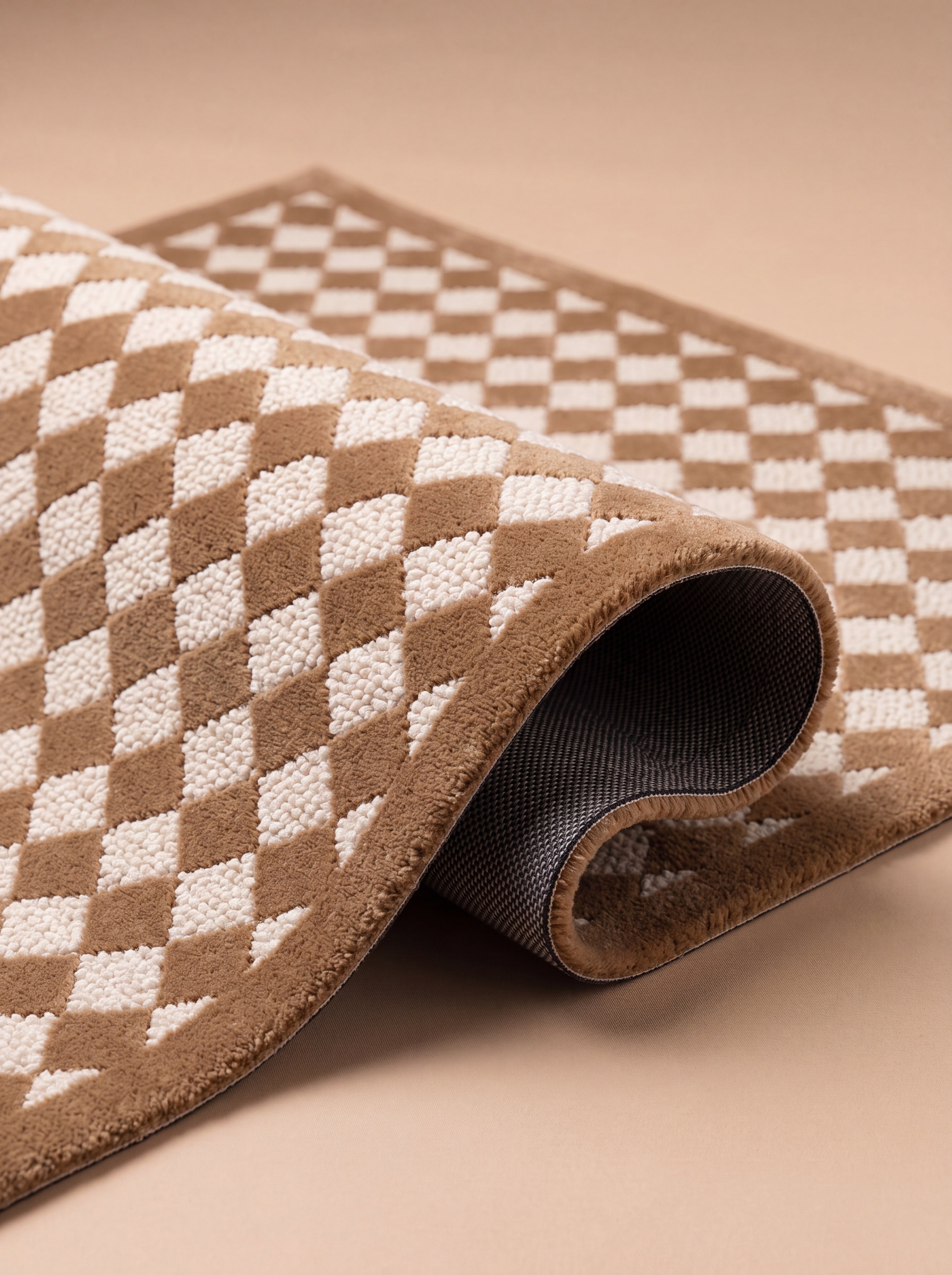 Close-up of The Diamond rug showing its hand-tufted texture and finished edge.