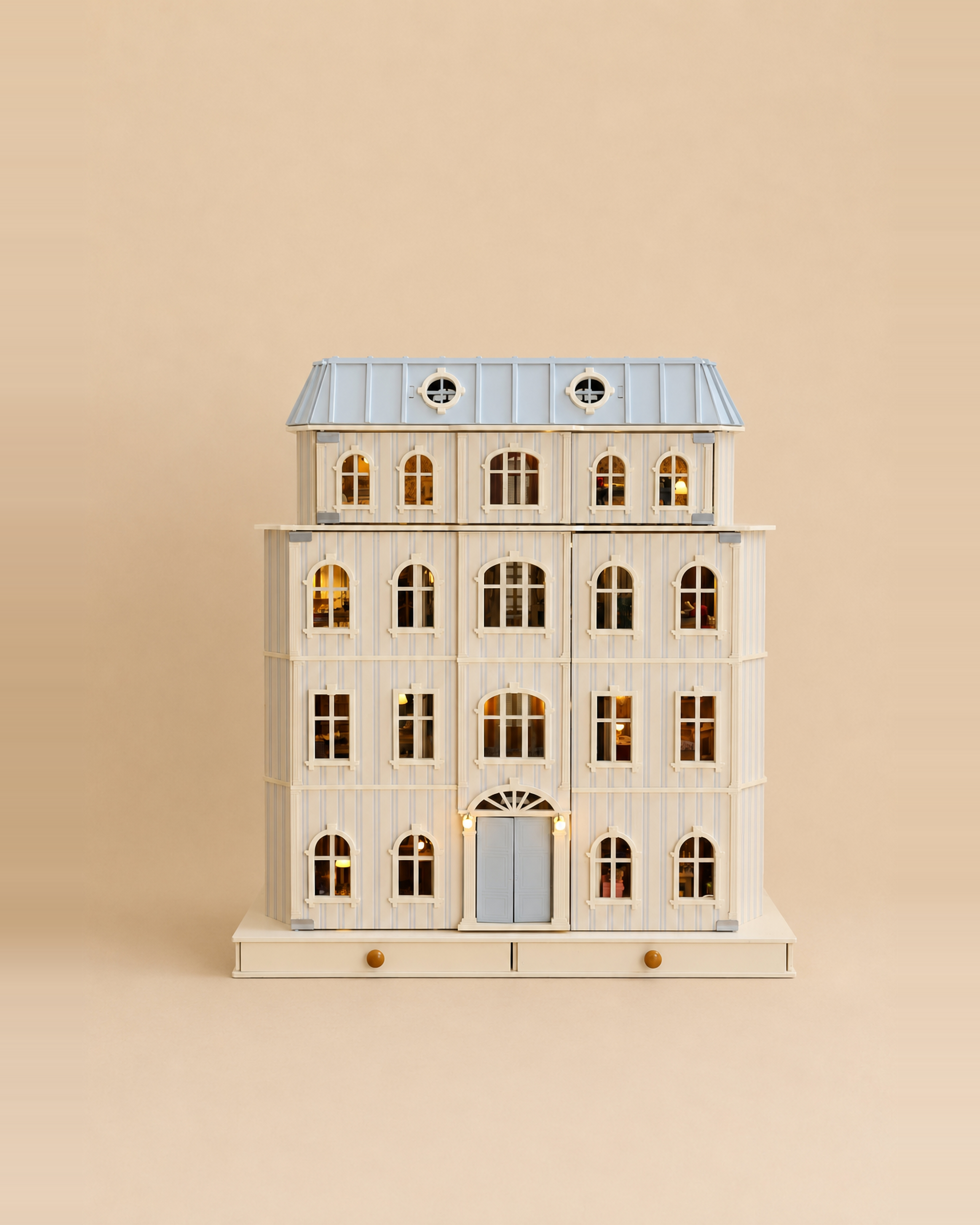 The House of Monaco wooden dollhouse shown in full, a six-storey handcrafted mansion with powder blue mansard roof.