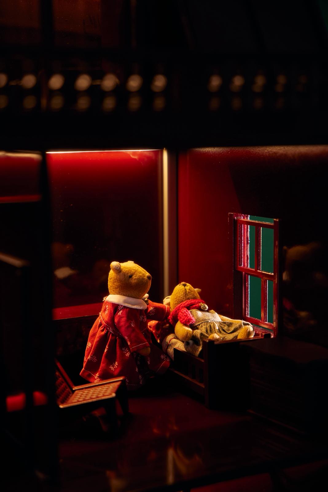 Miniature wooden bedroom with sleeping teddy bears under soft lights, House of Bordeaux by Little Forest Animals — handmade dollhouse scene symbolizing warmth, calm and Christmas dreams.