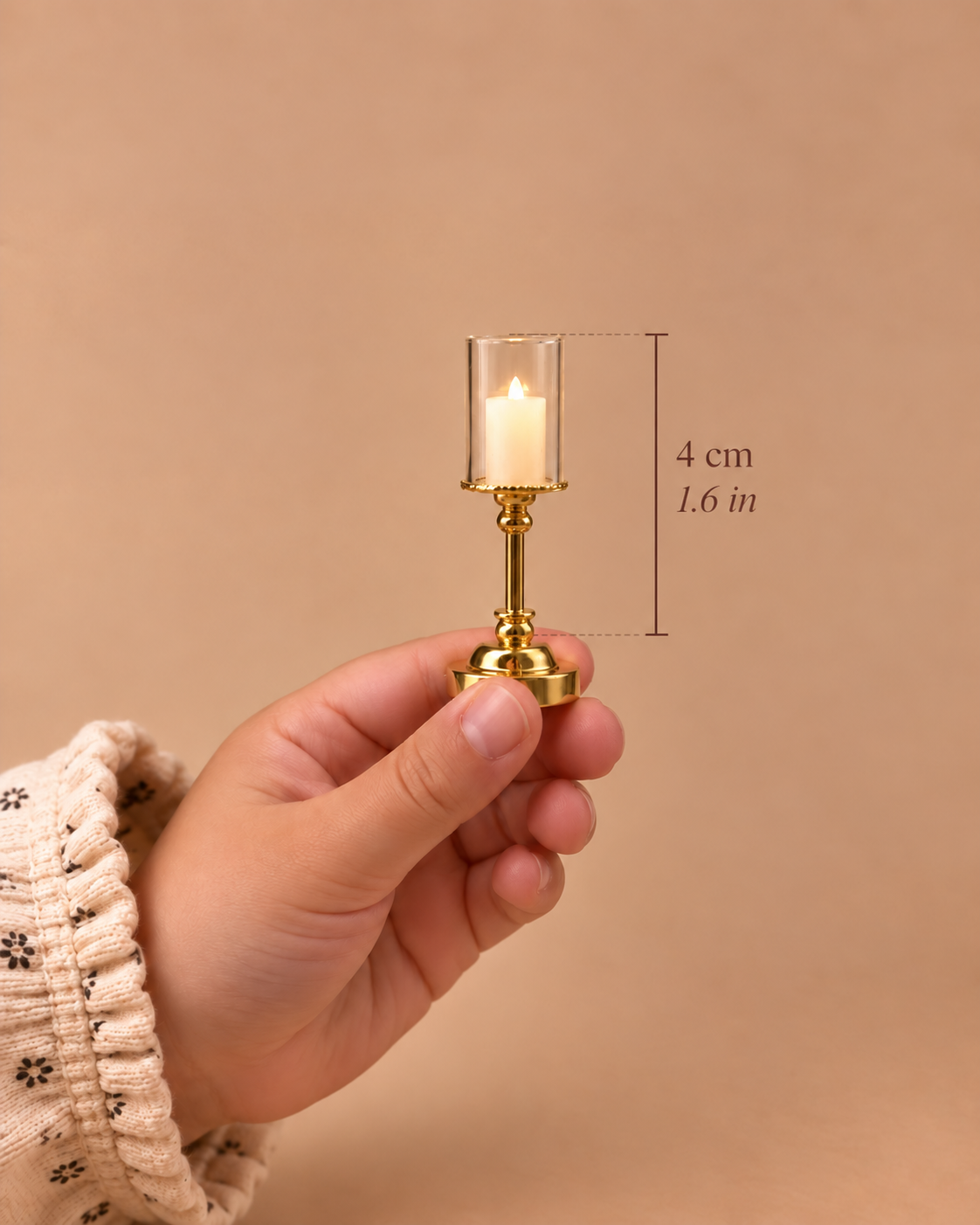 A 4 cm (1.6 in) gold hurricane lamp with a clear glass cylinder and warm candle-style light, made for detailed dollhouse interiors.