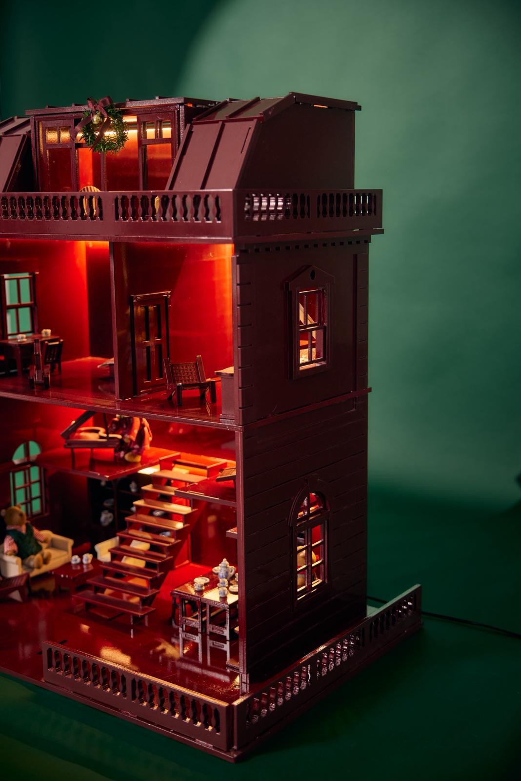 Wooden dollhouse with bear family