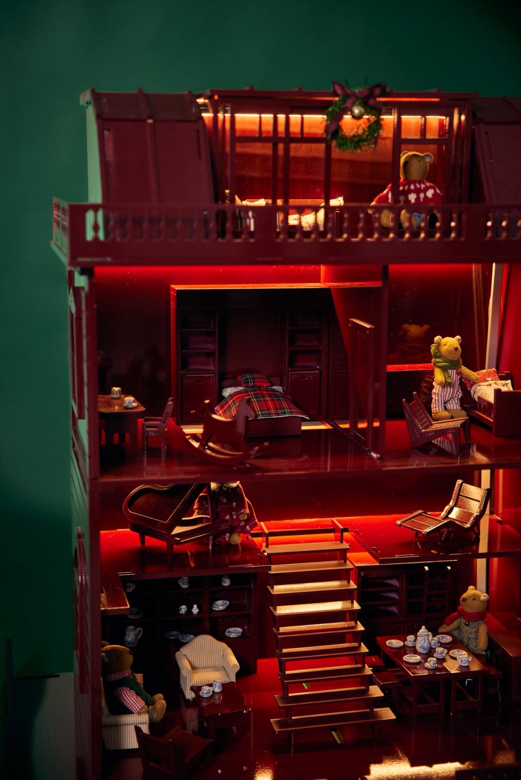 doll family in christmas dollhouse 