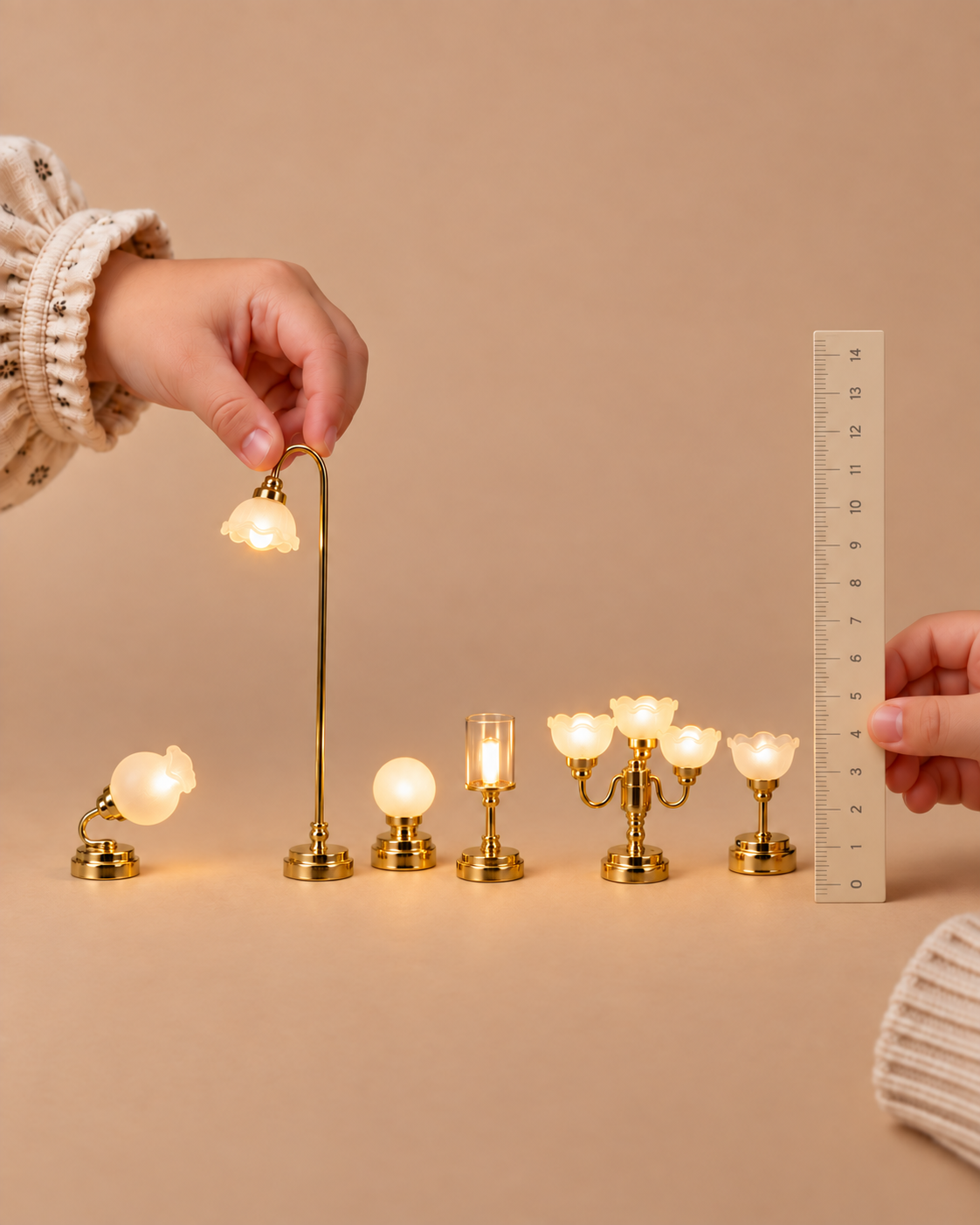 Six miniature brass dollhouse lamps shown with a ruler for scale.