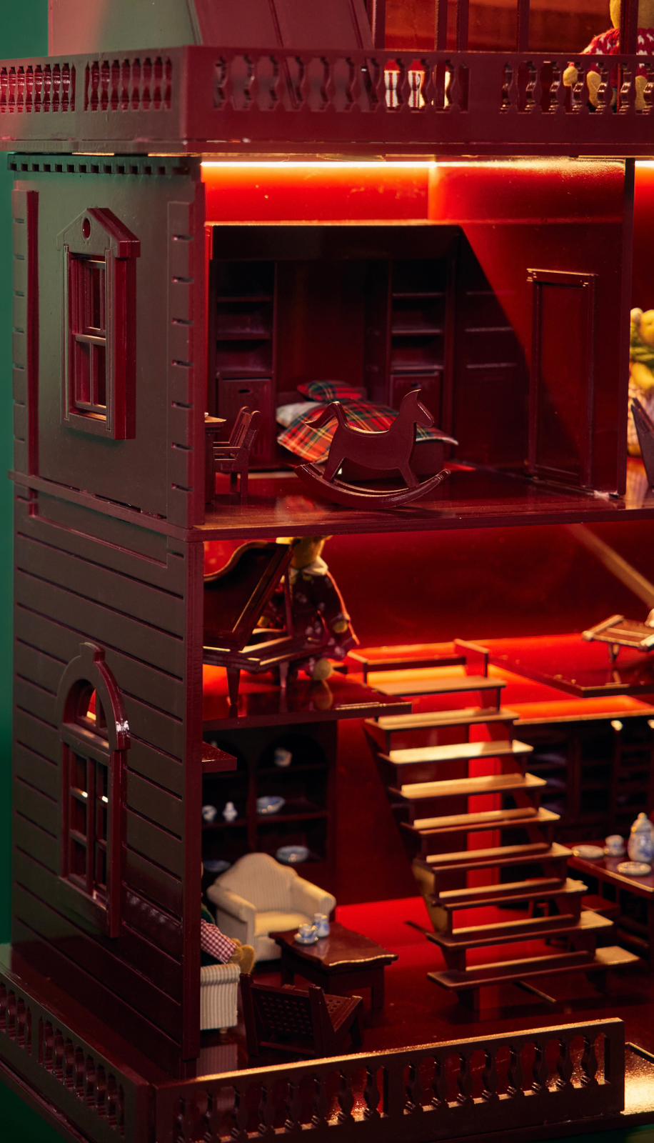 interior rooms and furniture, illuminated by red lighting.
