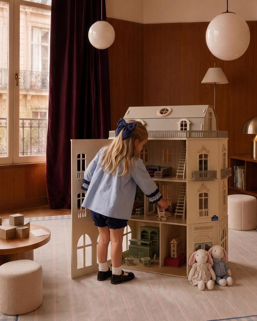 Designer wooden dollhouse with realistic miniature rooms, detailed interiors and working lights for children.
