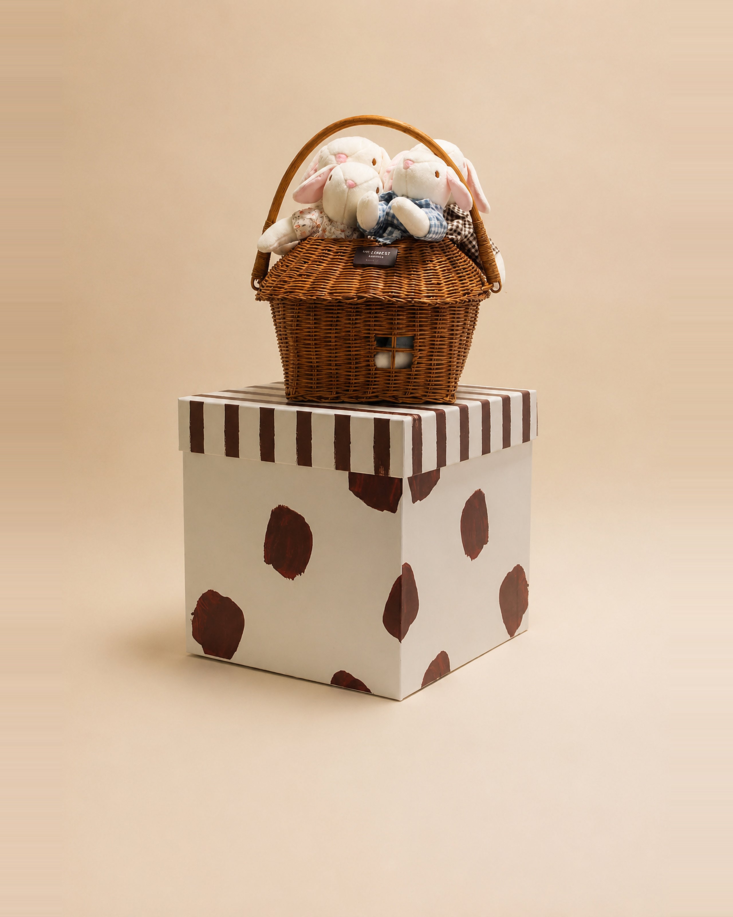 The Bellevue Family Grand bunny dolls tucked inside their woven gift basket.