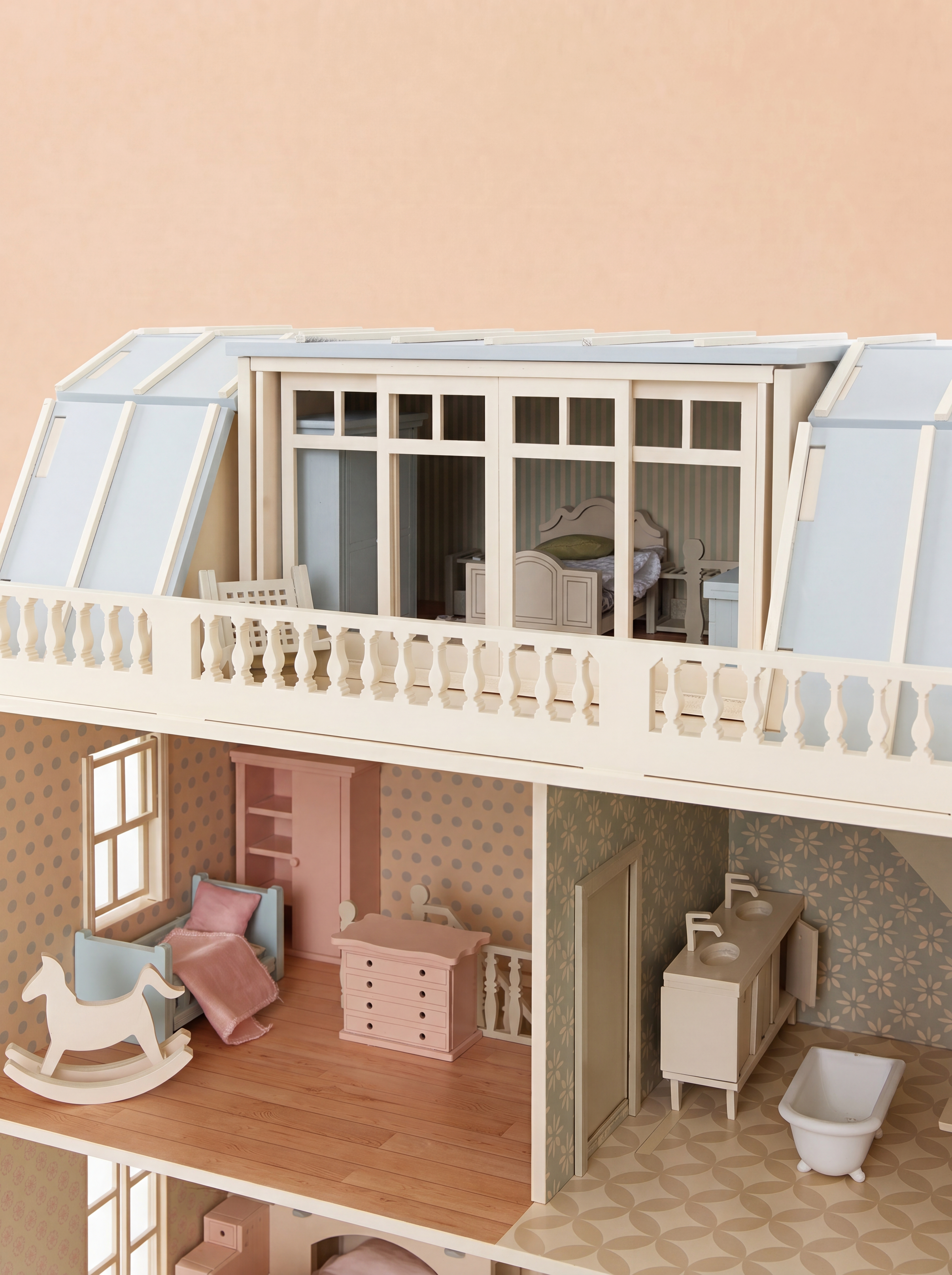 Top floor of the House of New York wooden dollhouse featuring a bedroom, nursery, bathroom, and rooftop terrace with detailed miniature furniture.