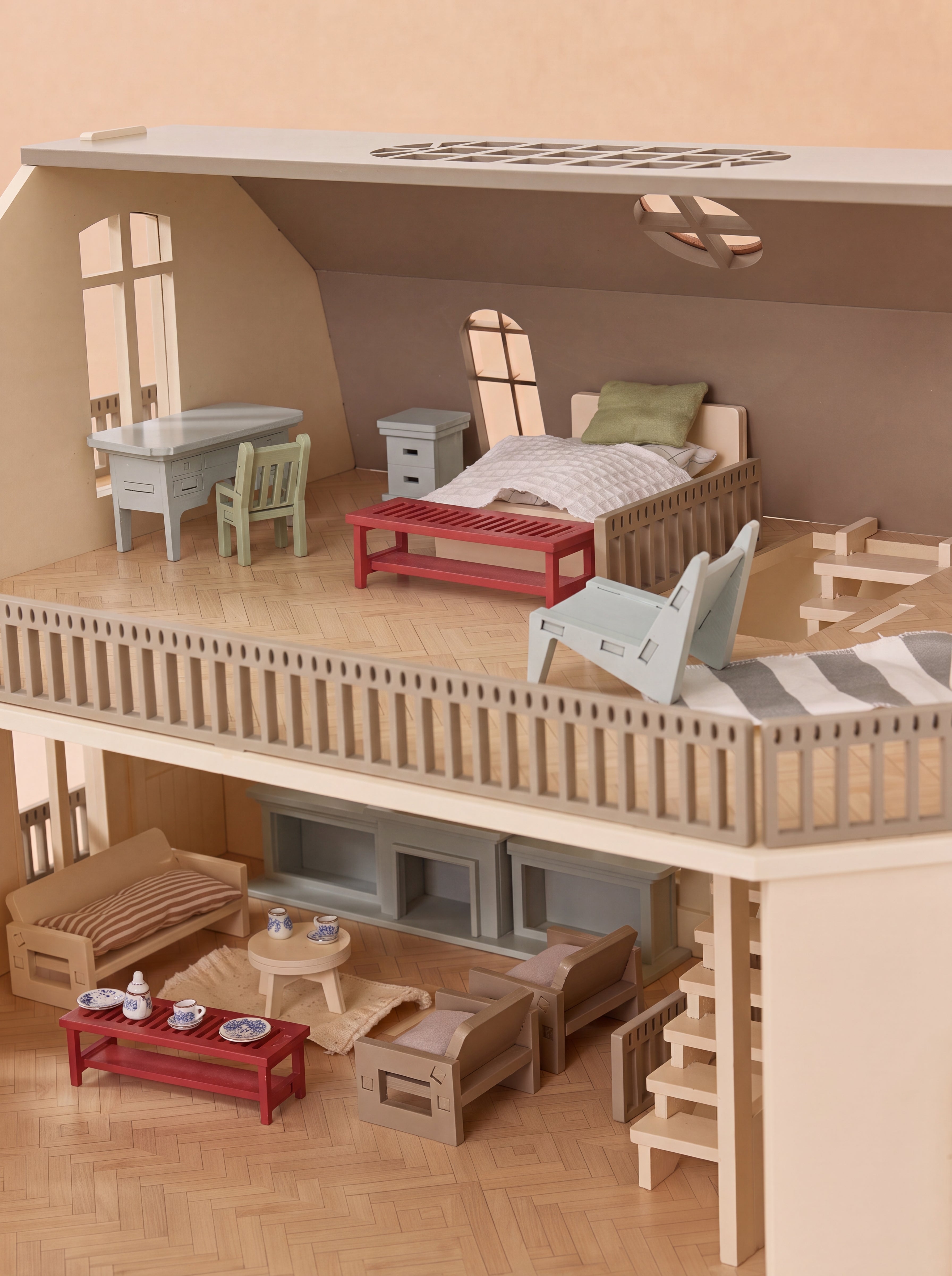 The open House of Paris dollhouse reveals detailed miniature rooms furnished across two spacious floors.