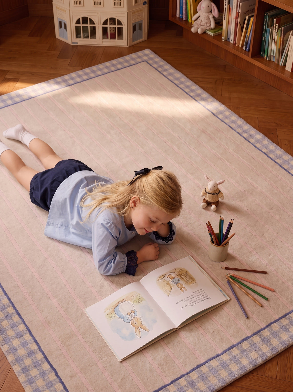 Girl drawing on The Gingham rug with a lavender gingham border in a children's reading room.