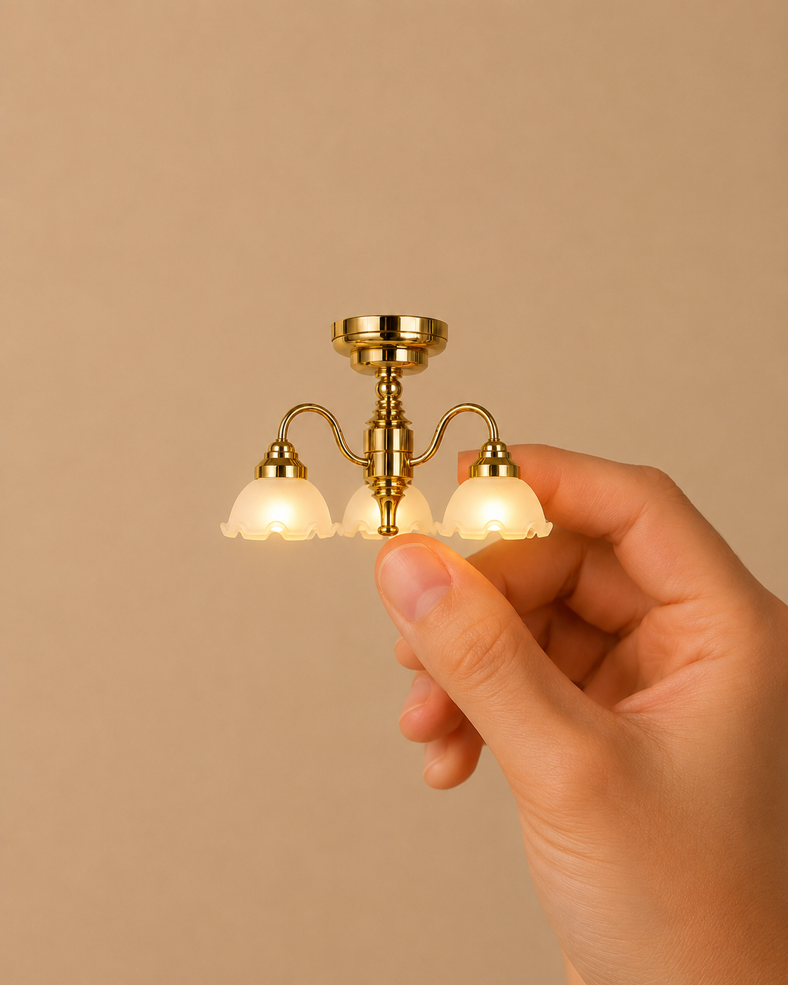 Miniature chandelier with two white glass shades.