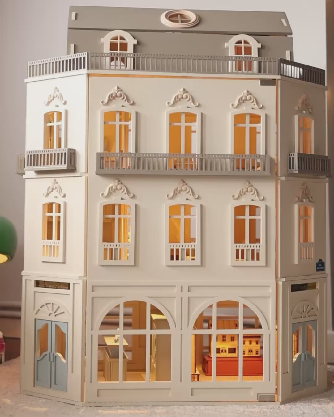 House of Paris wooden dollhouse with illuminated rooms, opening front panels, detailed interior spaces, and miniature accessories during imaginative play.