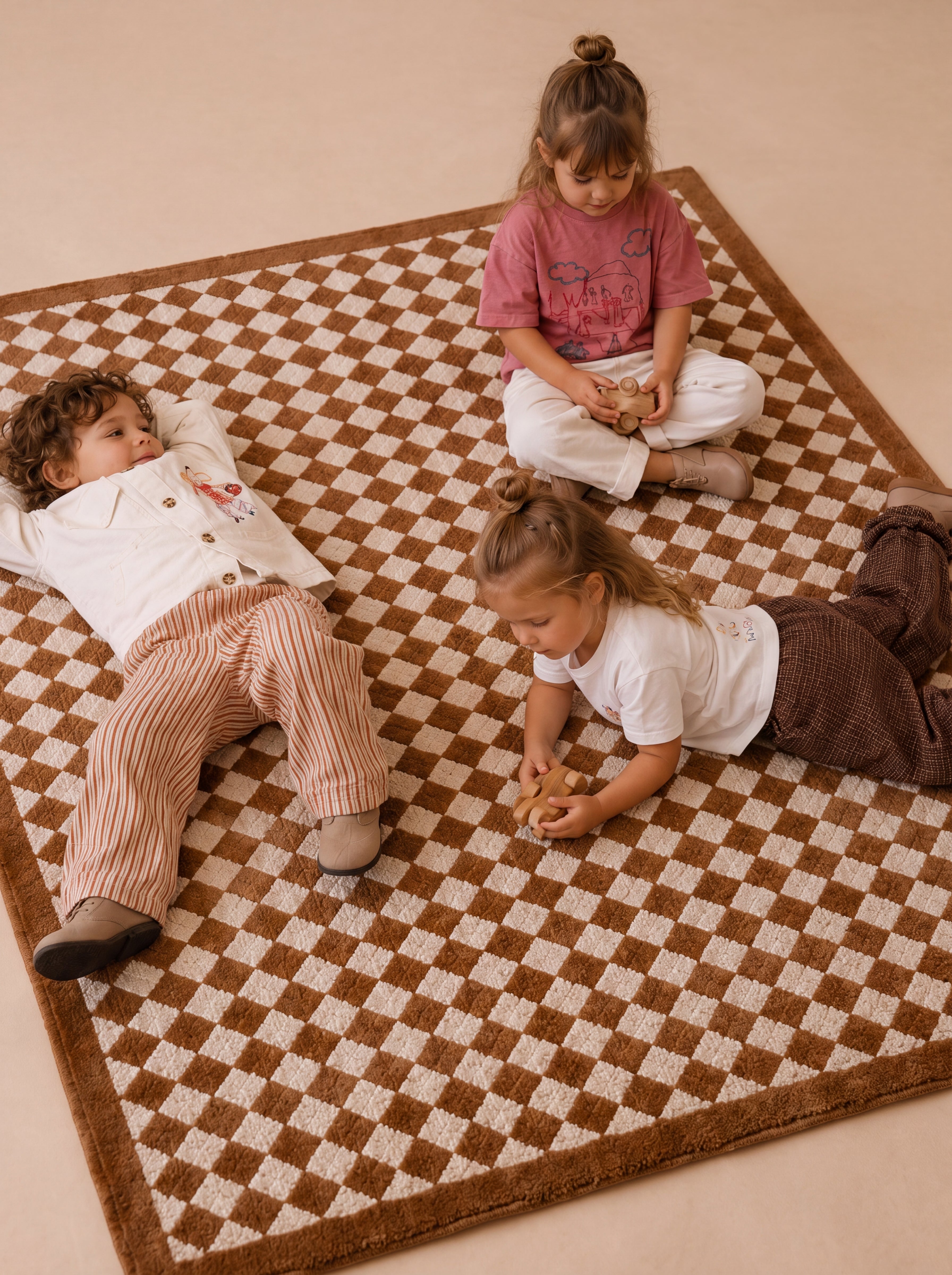 Angled view of The Diamond rug showcasing its classic diamond pattern in a family play space.