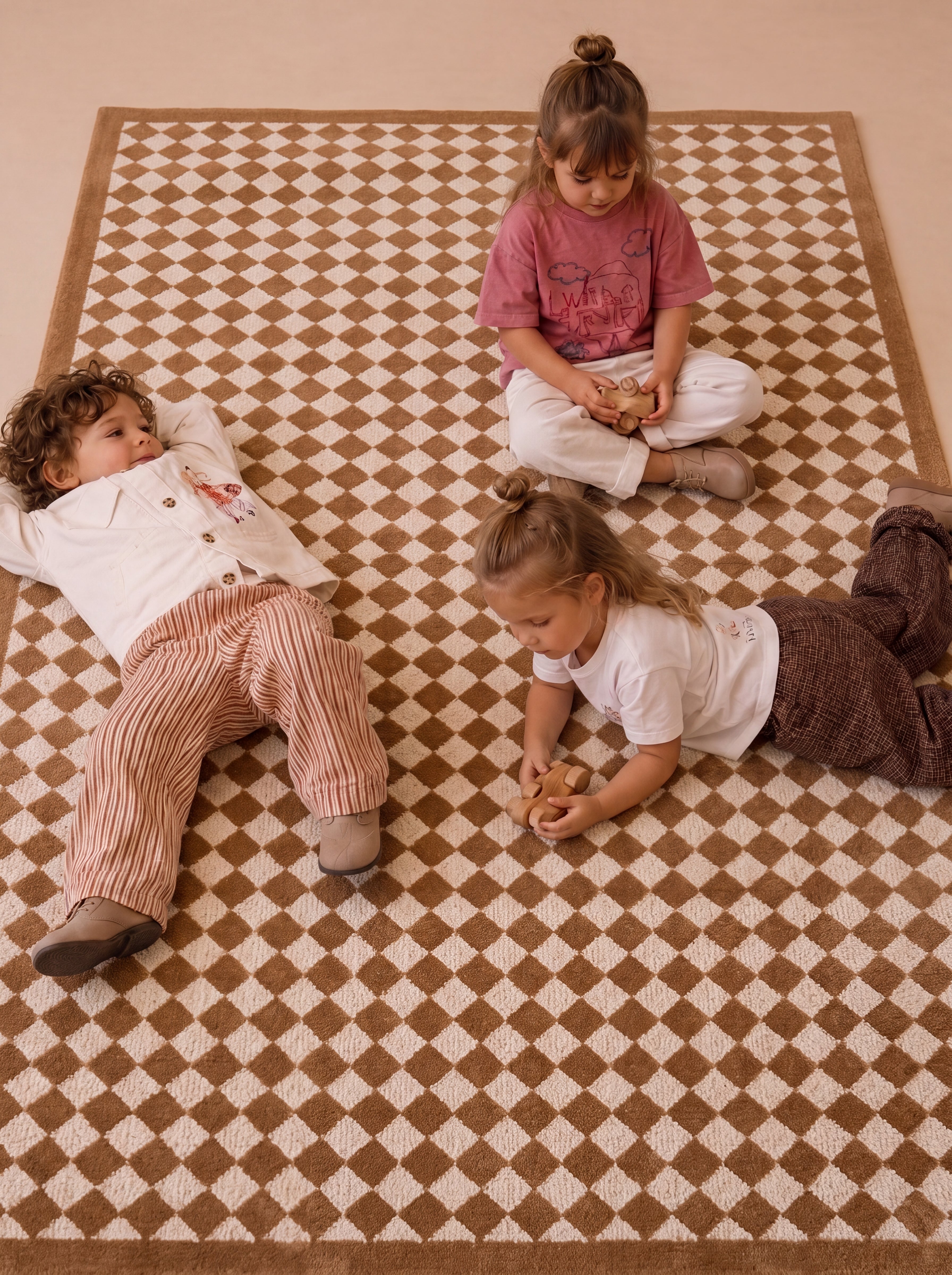 Overhead view of The Diamond rug featuring its classic diamond pattern during everyday play.