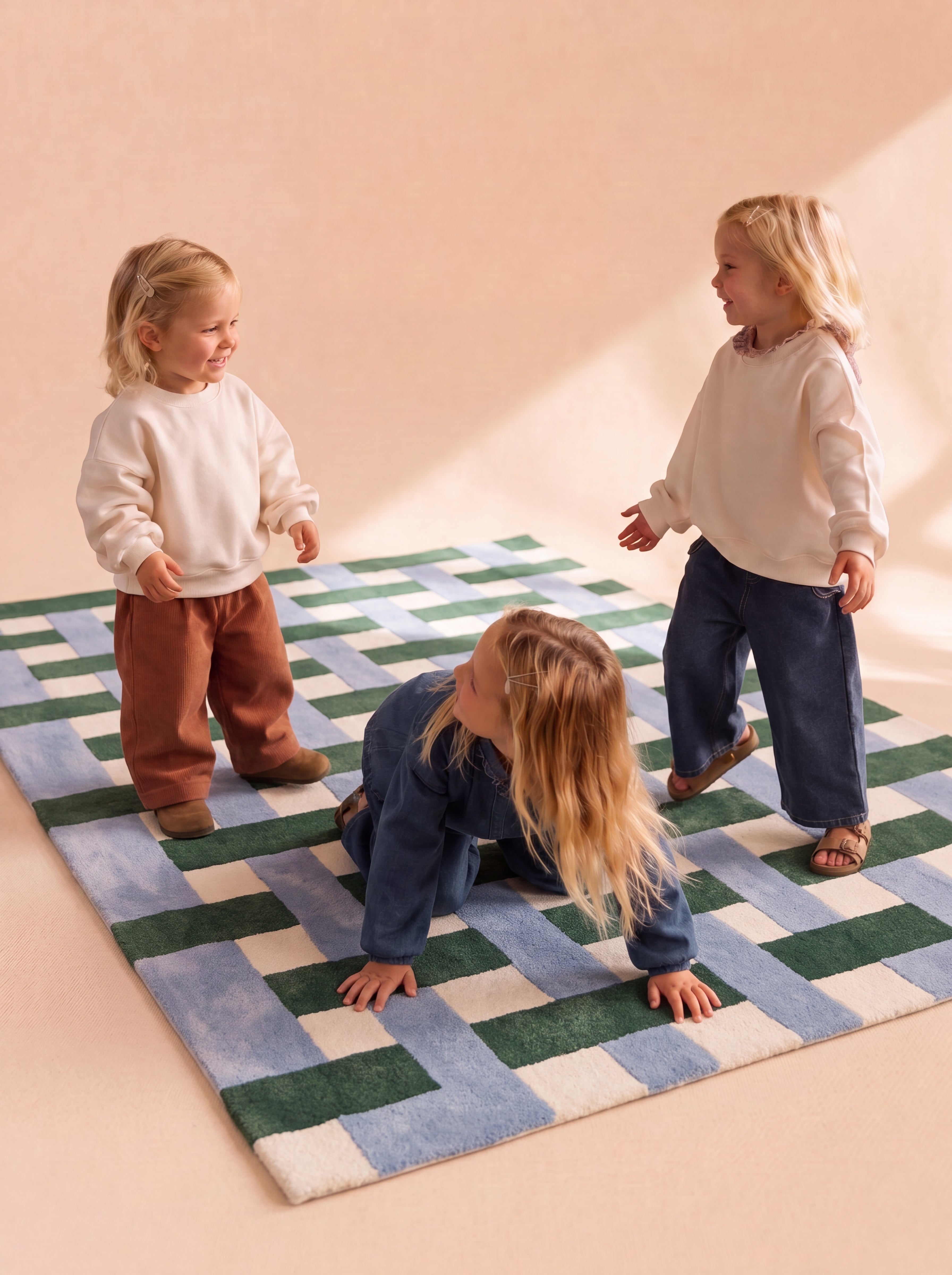 Kids enjoying playtime on a hand-tufted geometric rug.